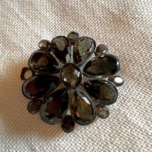 Belt buckle with taupe colored stones.